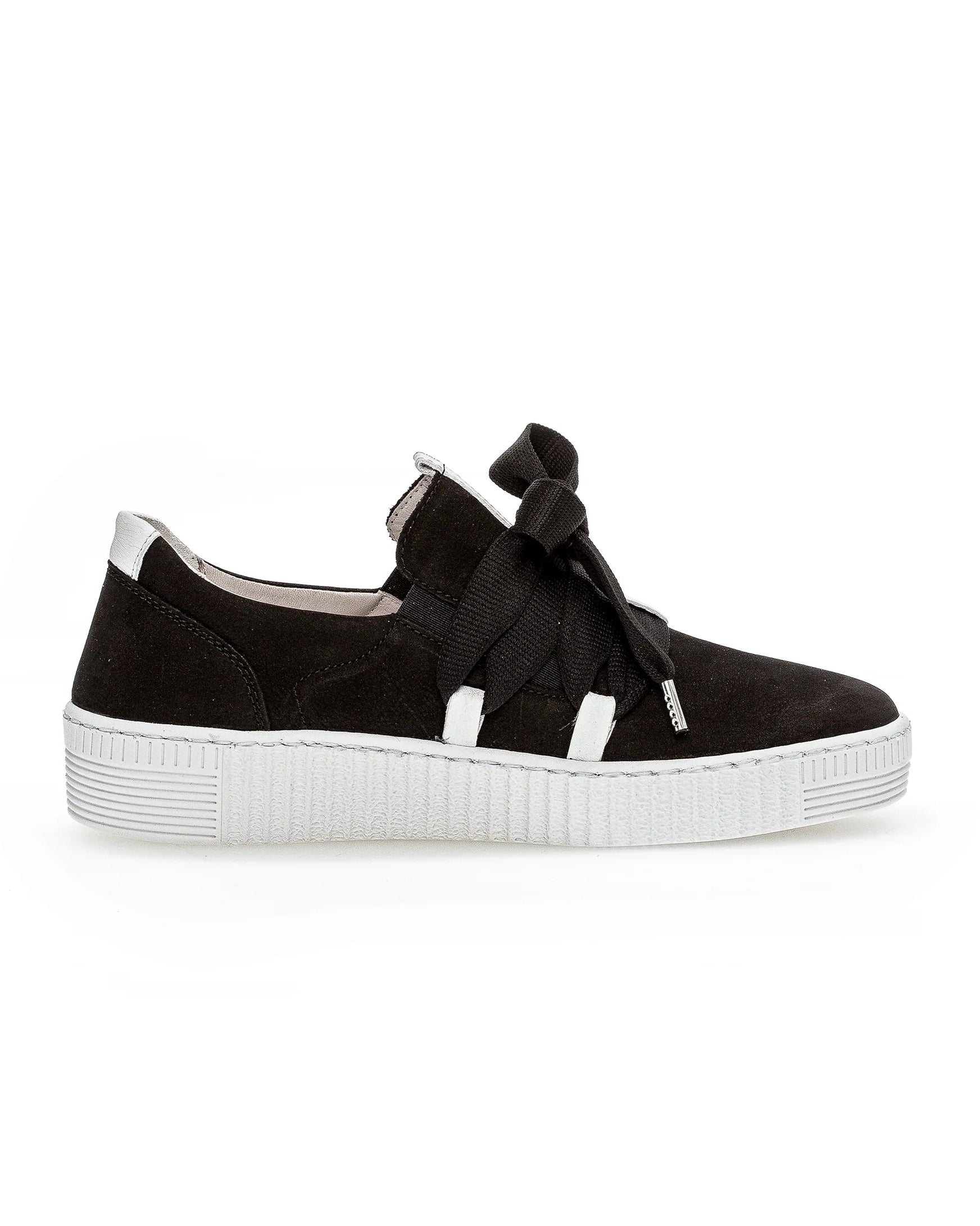A black slip-on platform sneaker with elastic side straps and a large bow detail on the side, set against a plain white background.