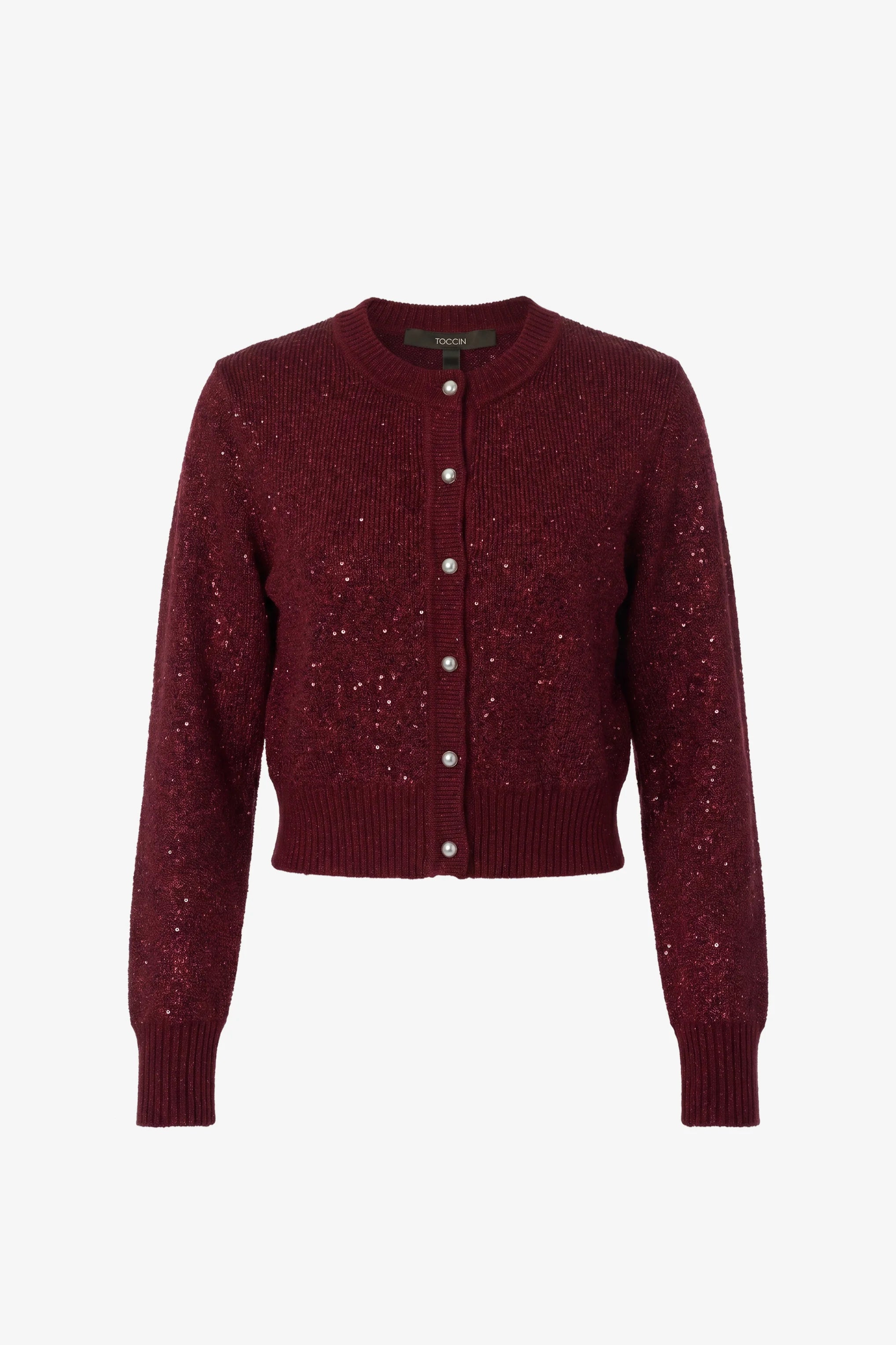 A cropped, long-sleeve knit cardigan in deep burgundy with a textured, sparkly knit pattern and a button-up front, shown against a plain white background.
